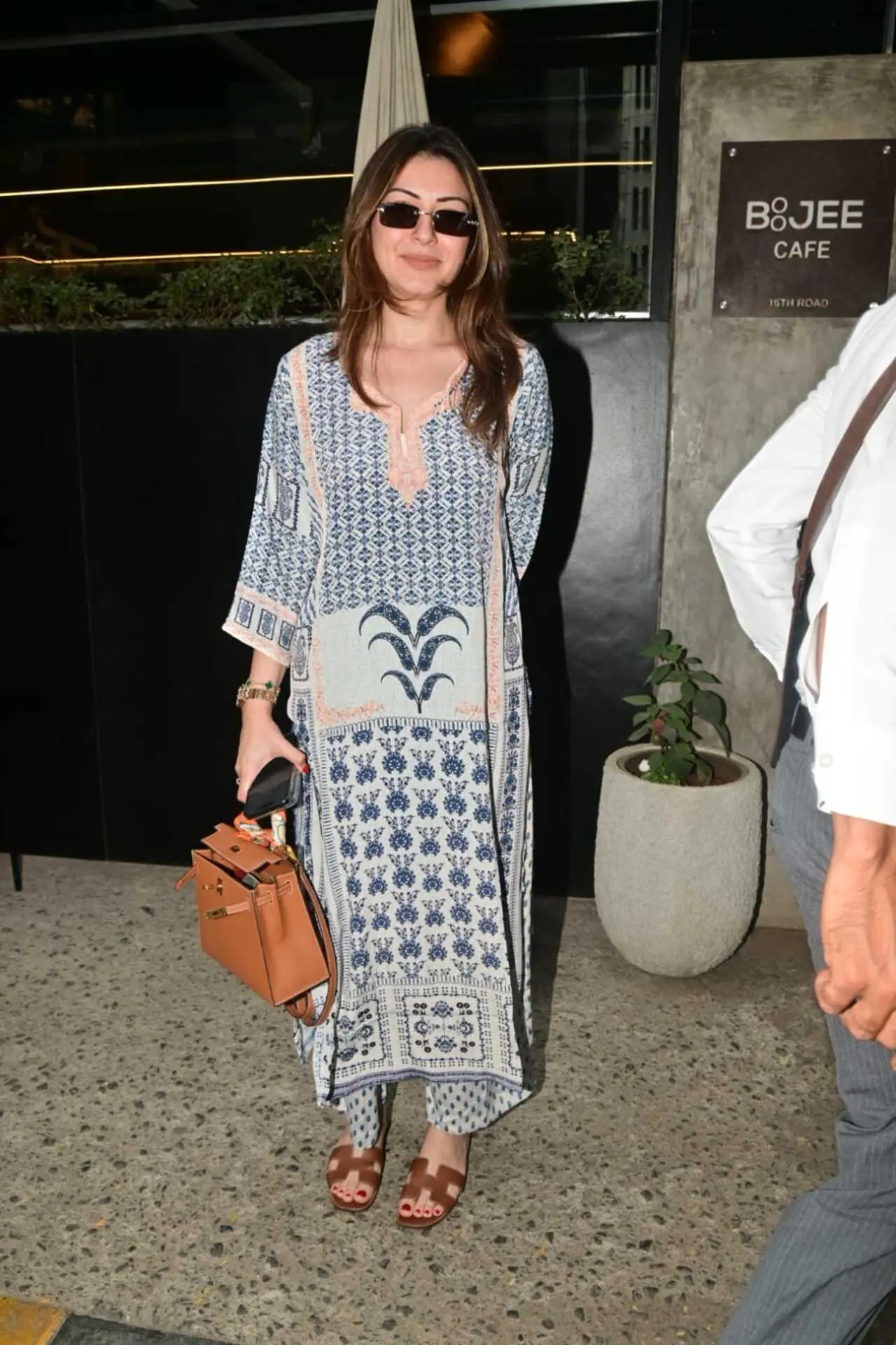 Hansika Motwani was spotted at the airport earlier on Tuesday and at a cafe in Bandra later during the day. She kept it easy-breezy in a loose, printed kurta set as she stepped out for coffee.